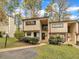 Traditional home with a beautiful lawn, mature trees, and a charming entryway at 717 E Millbrook Rd, Raleigh, NC 27609