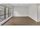 A bright living room with wood floors, and large windows at 717 E Millbrook Rd, Raleigh, NC 27609