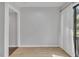 Neutral room with luxury vinyl plank flooring and a sliding glass door to the exterior at 717 E Millbrook Rd, Raleigh, NC 27609