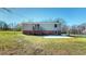 Large backyard with deck and patio, great for entertaining or relaxing at 72 Edgemont Ave, Roxboro, NC 27573