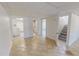 Spacious basement area with accessible bathroom, stairs, and kitchen/bar area at 72 Edgemont Ave, Roxboro, NC 27573