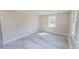 Bedroom with bright windows and neutral walls and light-colored floors at 72 Edgemont Ave, Roxboro, NC 27573