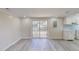 Large kitchen and dining area with new flooring and sliding glass doors to a patio at 72 Edgemont Ave, Roxboro, NC 27573