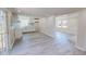 Bright, open-concept kitchen and living area with new flooring and fresh paint at 72 Edgemont Ave, Roxboro, NC 27573