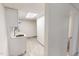 Small white kitchenette area with grey flooring and white walls at 72 Edgemont Ave, Roxboro, NC 27573