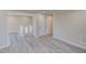 Spacious room with access to the front door and hallway with stairs at 72 Edgemont Ave, Roxboro, NC 27573