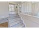 Staircase with natural wood and white trim at 72 Edgemont Ave, Roxboro, NC 27573