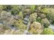 Overhead view of the home with mature trees, highlighting the neighborhood's streetscape and driveway at 7317 Mill Ridge Rd, Raleigh, NC 27613