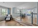Bright dining room features hardwood floors and large window overlooking a landscaped yard at 7317 Mill Ridge Rd, Raleigh, NC 27613