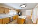 Well-lit kitchen features an island, stainless steel appliances, granite countertops, and wooden cabinets at 772 Old Allensville, Roxboro, NC 27574