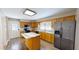 Large kitchen with an island, stainless steel appliances, and wood cabinets at 772 Old Allensville, Roxboro, NC 27574