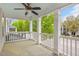 Inviting covered porch features classic white columns and railings with calming blue ceiling at 7819 Acc Blvd, Raleigh, NC 27612