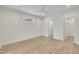 This is an empty bedroom featuring a window, walk-in closet, and light wood flooring at 8 Nottingham Pl, Smithfield, NC 27577