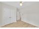 Bright bedroom with hardwood floors and closet doors, ready for personalization at 8 Nottingham Pl, Smithfield, NC 27577