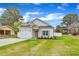 Beautiful one-story home with a well-maintained lawn, white siding, and inviting curb appeal at 8 Nottingham Pl, Smithfield, NC 27577