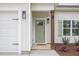 Close up of the front door with its welcoming green color and well-maintained entryway at 8 Nottingham Pl, Smithfield, NC 27577