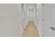 Bright hallway with hardwood floors leading to the front door, showcasing the home's interior at 8 Nottingham Pl, Smithfield, NC 27577