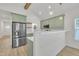 The kitchen features green cabinets, stainless steel appliances, and a breakfast bar area at 8 Nottingham Pl, Smithfield, NC 27577