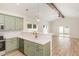 Modern kitchen with new appliances, stylish countertops, and open layout to living area at 8 Nottingham Pl, Smithfield, NC 27577