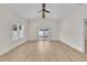 Open living room boasts natural light, vaulted ceiling and sliding glass door to the backyard at 8 Nottingham Pl, Smithfield, NC 27577