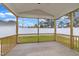 View of the screened porch featuring wood and screen construction and concrete flooring, perfect for outdoor enjoyment at 8 Nottingham Pl, Smithfield, NC 27577