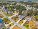 Scenic aerial view of a neighborhood featuring lush greenery, well-kept homes, and peaceful cul-de-sacs at 801 Noconia Pl, Fuquay Varina, NC 27526
