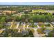 Scenic aerial view of a neighborhood featuring lush greenery, well-kept homes, and well-maintained streets at 801 Noconia Pl, Fuquay Varina, NC 27526