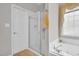 Bathroom featuring glass enclosed shower, tub with jets, and privacy window at 801 Noconia Pl, Fuquay Varina, NC 27526