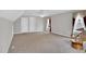 Bright bedroom with neutral walls, patterned carpeting, and two closets offering ample storage space at 801 Noconia Pl, Fuquay Varina, NC 27526