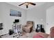 Comfortable bedroom with a ceiling fan and workspace; ideal for relaxation or working from home at 801 Noconia Pl, Fuquay Varina, NC 27526