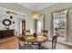 Charming dining area featuring hardwood floors and a decorative chandelier lighting at 801 Noconia Pl, Fuquay Varina, NC 27526