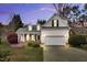 Charming home featuring a manicured lawn, two car garage, and architectural roof at 801 Noconia Pl, Fuquay Varina, NC 27526