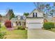 Charming home featuring a manicured lawn, two car garage, and architectural roof at 801 Noconia Pl, Fuquay Varina, NC 27526