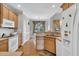Classic kitchen with ample cabinet space and hardwood floors at 801 Noconia Pl, Fuquay Varina, NC 27526