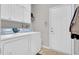 Clean laundry room with white washer and dryer at 801 Noconia Pl, Fuquay Varina, NC 27526