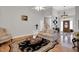 Bright living room with hardwood floors, high ceiling, and a decorative area rug at 801 Noconia Pl, Fuquay Varina, NC 27526