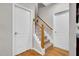 Carpeted staircase with white risers and stained wood handrail at 801 Noconia Pl, Fuquay Varina, NC 27526