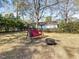 Backyard featuring a swing and firepit, perfect for outdoor entertaining and relaxation at 806 S First St, Smithfield, NC 27577