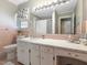 Bathroom features pink tile, a large vanity, ample lighting, and a large mirror at 806 S First St, Smithfield, NC 27577