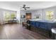 Spacious bedroom featuring hardwood floors, a ceiling fan, and natural light at 806 S First St, Smithfield, NC 27577