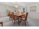 Dining room with chandelier, light walls and a wooden table with seating for six at 806 S First St, Smithfield, NC 27577
