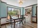 Dining room with large window overlooking backyard and built in shelving at 806 S First St, Smithfield, NC 27577