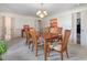 Dining room with chandelier, light walls and a wooden table with seating for six at 806 S First St, Smithfield, NC 27577