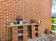 Exterior shot highlighting a brick wall with a potters bench and exposed shelves at 806 S First St, Smithfield, NC 27577