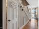 Inviting foyer entrance with 'Cupboard Under the Stairs' sign and staircase at 806 S First St, Smithfield, NC 27577
