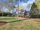 Charming brick home with blue shutters, well-manicured lawn, and a welcoming brick walkway at 806 S First St, Smithfield, NC 27577