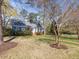 Charming brick home with blue shutters, well-manicured lawn, and a welcoming brick walkway at 806 S First St, Smithfield, NC 27577