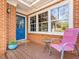 Inviting front porch with a blue door and a cozy seating area at 806 S First St, Smithfield, NC 27577