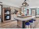 Charming kitchen with brick oven, island, painted cabinets, and modern appliances at 806 S First St, Smithfield, NC 27577