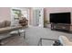 Spacious living room featuring a piano, large TV, and comfortable seating at 806 S First St, Smithfield, NC 27577
